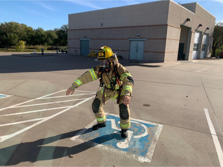 Firefighter doing air squats