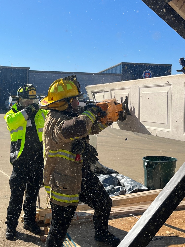 Firefighter cutting a garage door