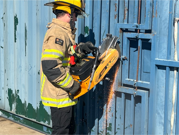 Firefighter cutting rebar